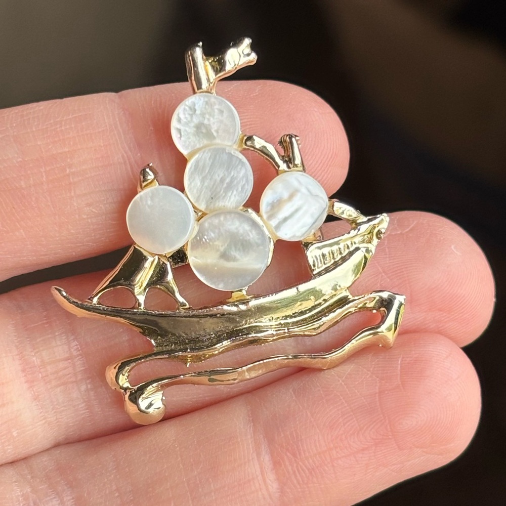 Vintage mother of pearl sailboat brooch